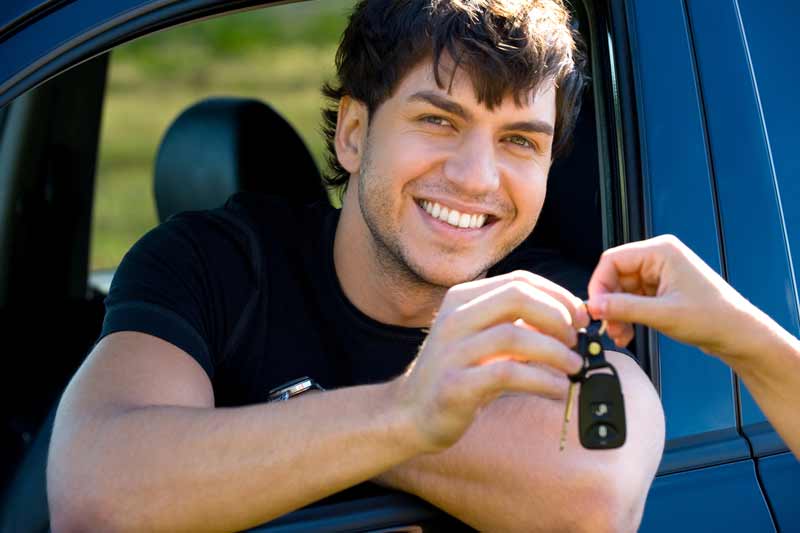 Happy woman financing her new car